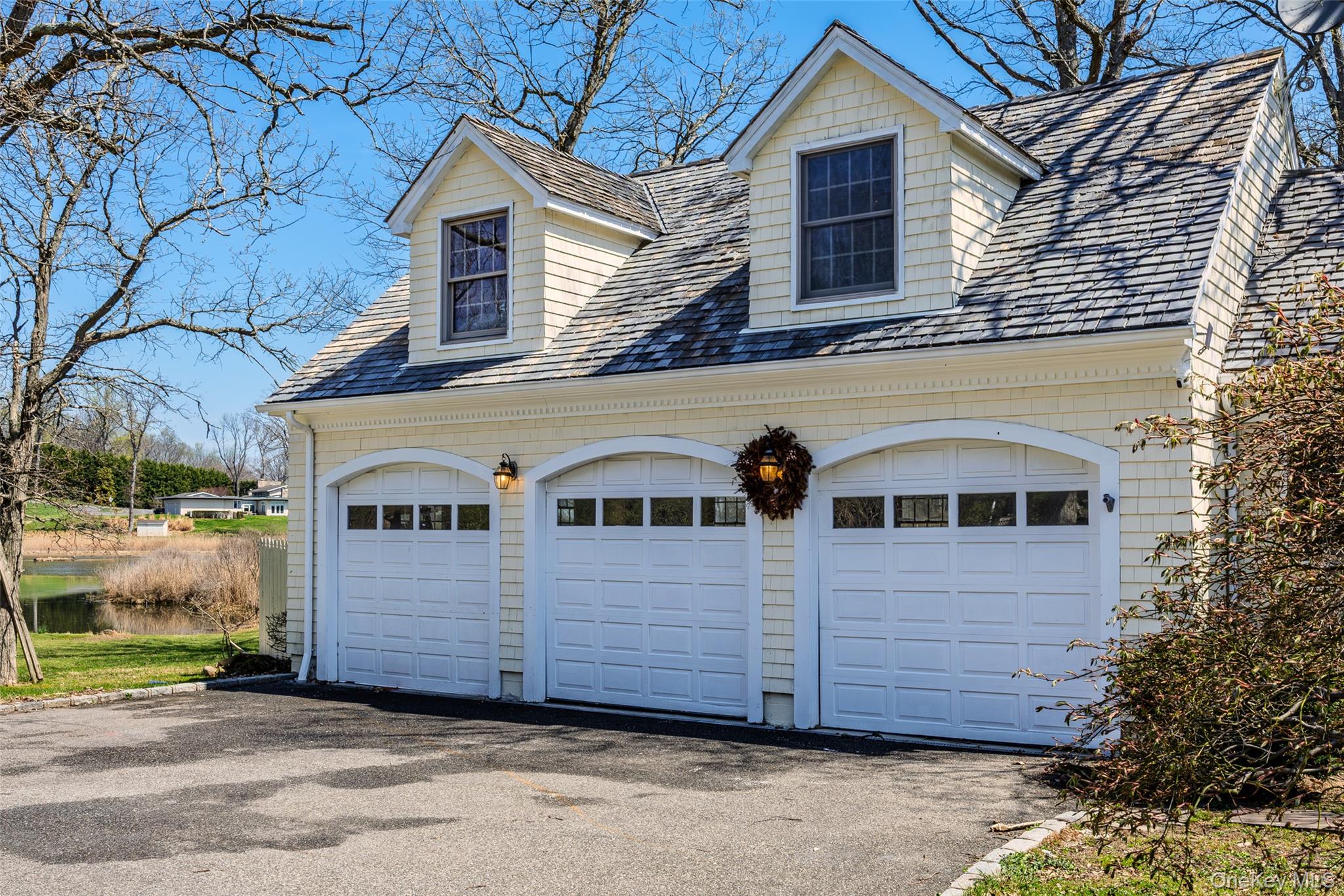 235 Centre Island Road Centre Island, NY 11771 - Photo 27 of 32 a front view of a house with a yard