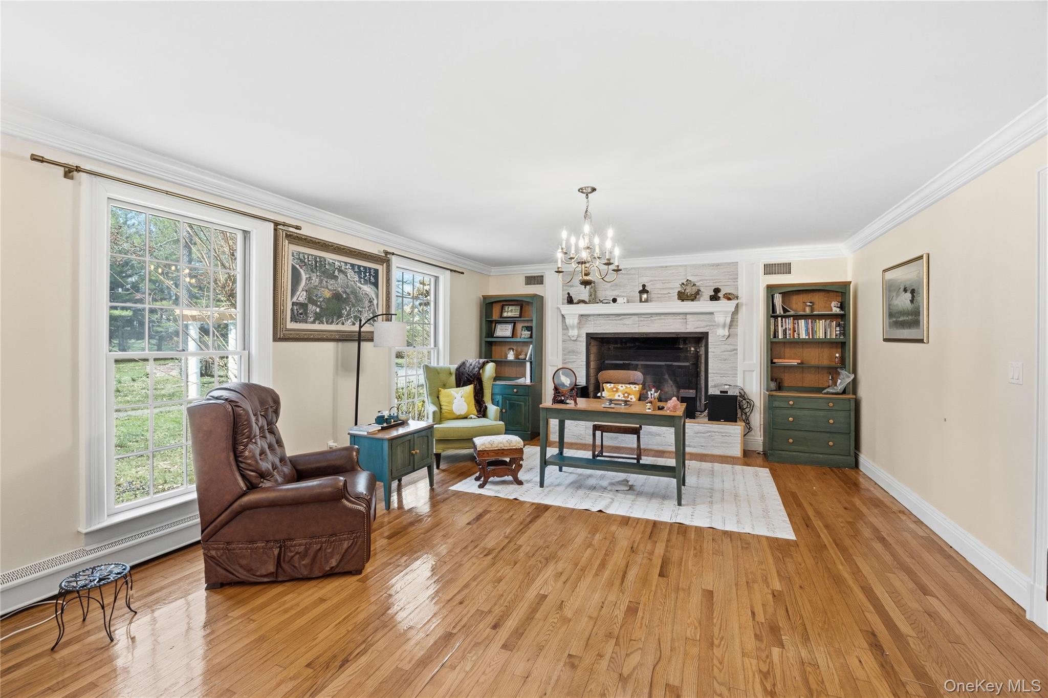 235 Centre Island Road Centre Island, NY 11771 - Photo 5 of 32 a living room with furniture and a fireplace