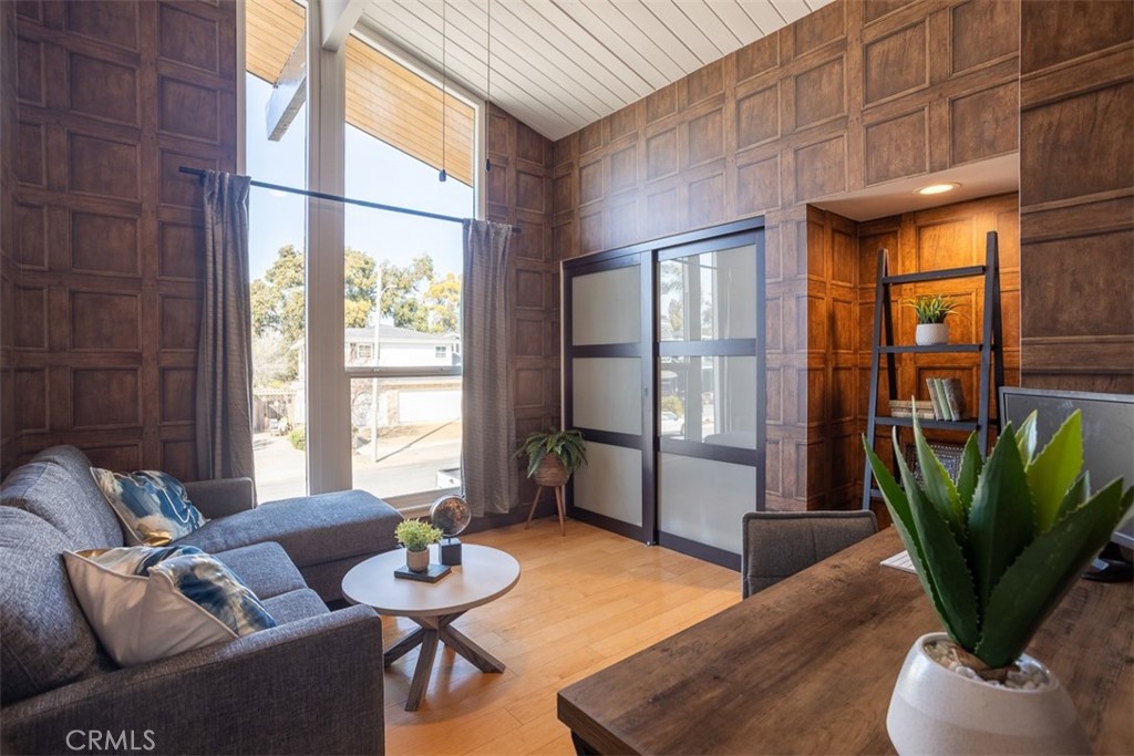 1420 Crestview Avenue Seal Beach, CA 90740 - Photo 18 of 26 a living room with furniture a potted plant and a large window