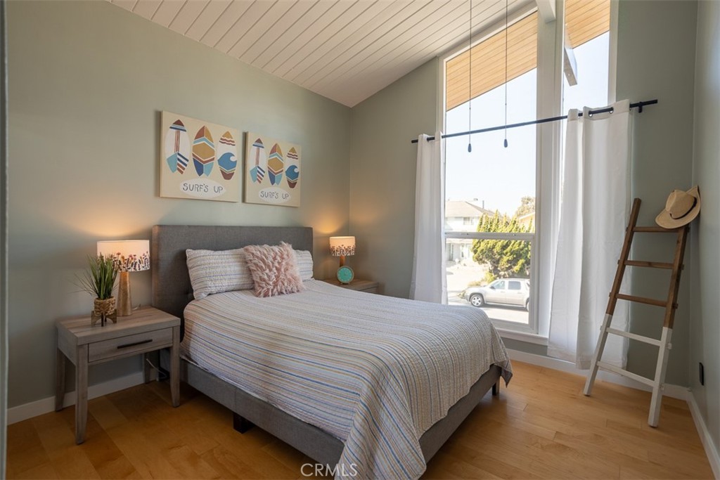 1420 Crestview Avenue Seal Beach, CA 90740 - Photo 19 of 26 a bedroom with a bed and a window