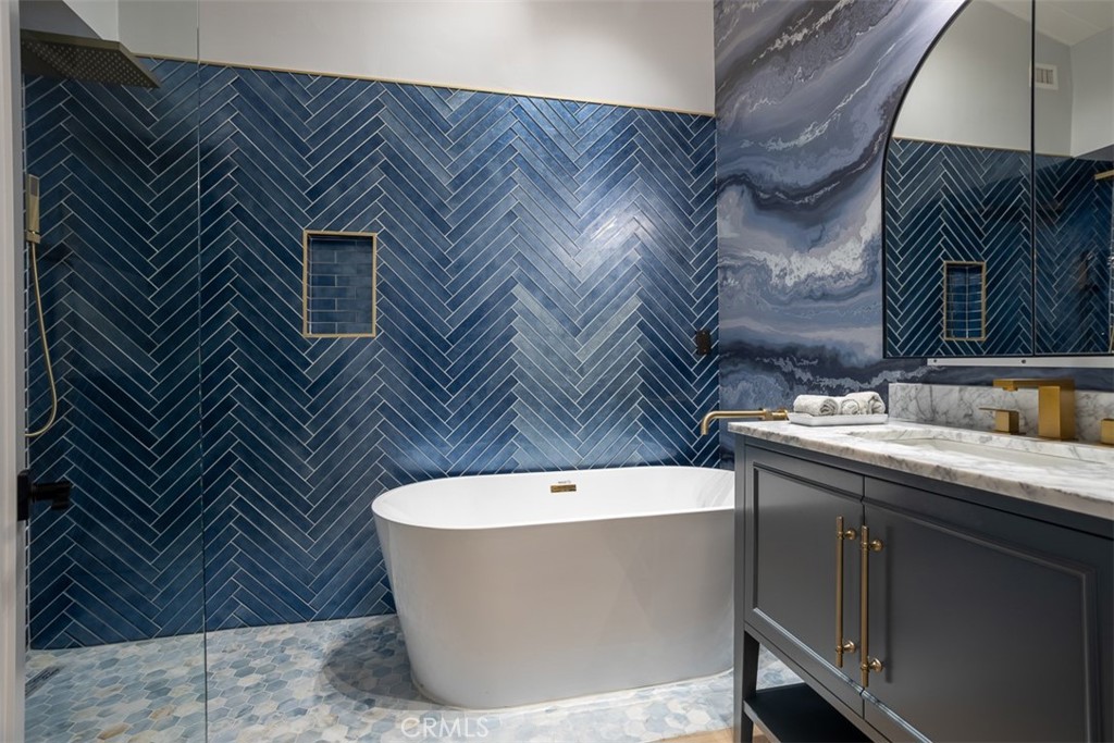 1420 Crestview Avenue Seal Beach, CA 90740 - Photo 20 of 26 a white bath tub sitting next to a bathroom sink