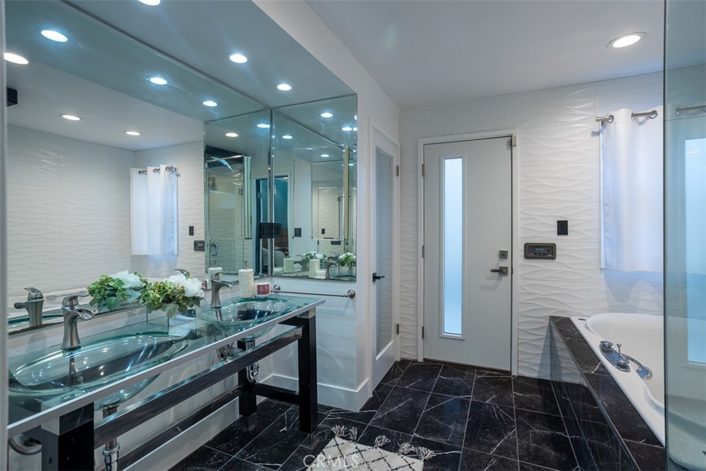 1420 Crestview Avenue Seal Beach, CA 90740 - Photo 22 of 26 a bathroom with sink and mirror