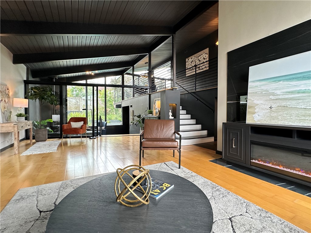 1420 Crestview Avenue Seal Beach, CA 90740 - Photo 4 of 26 a living room with fireplace furniture and a flat screen tv