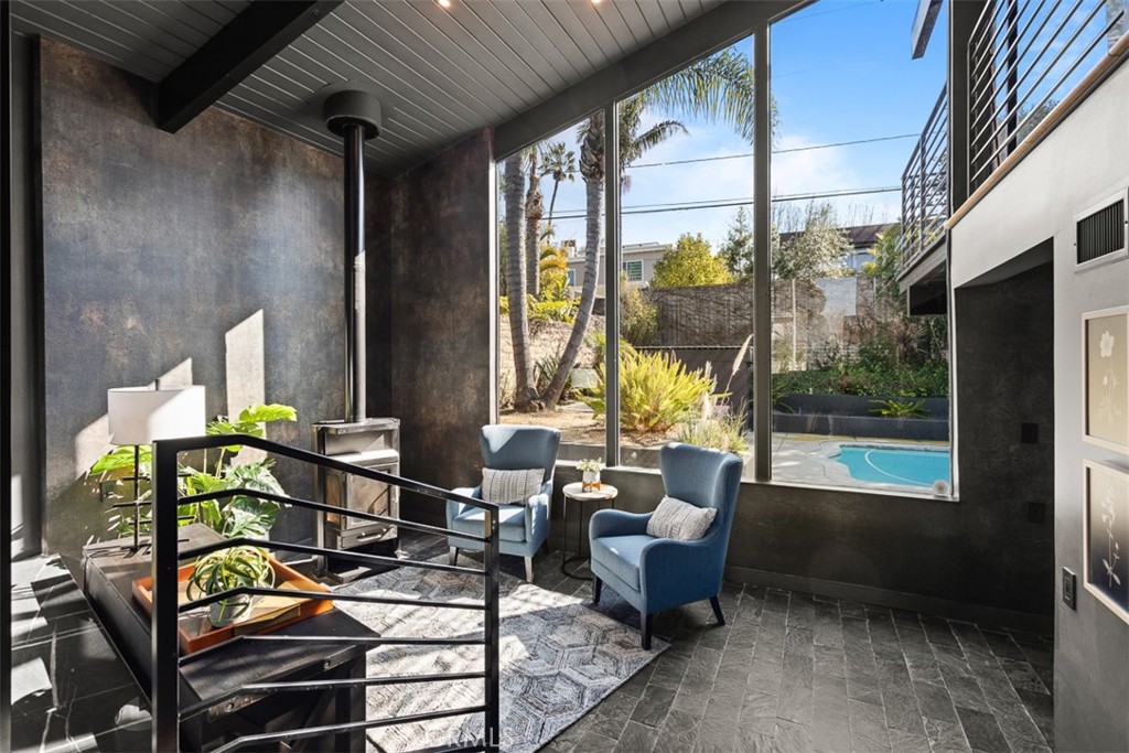 1420 Crestview Avenue Seal Beach, CA 90740 - Photo 9 of 26 a living room with furniture and a floor to ceiling window