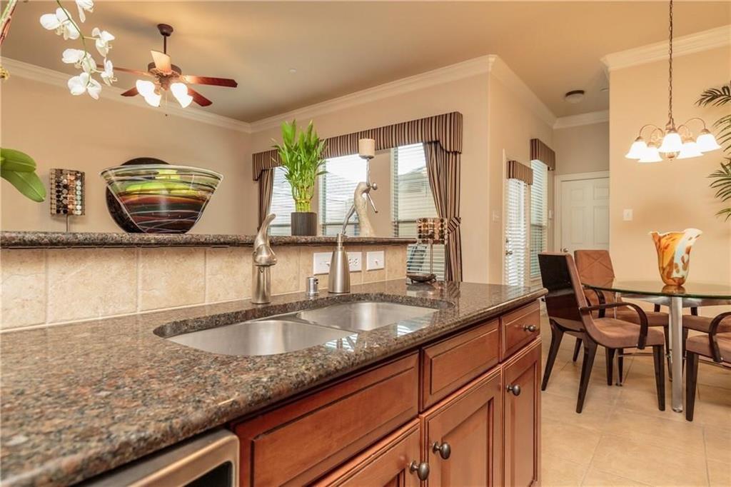 4673 Edith Street Plano, TX 75024 - Photo 13 of 35 a kitchen with a table and chairs in it