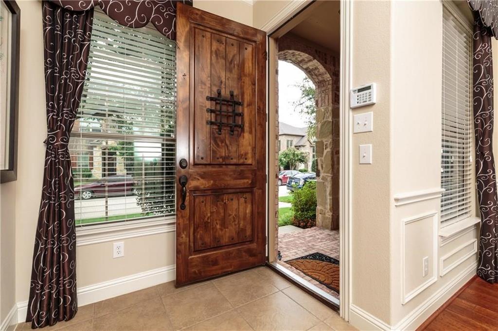 4673 Edith Street Plano, TX 75024 - Photo 6 of 35 a view of a porch with a floor to ceiling window