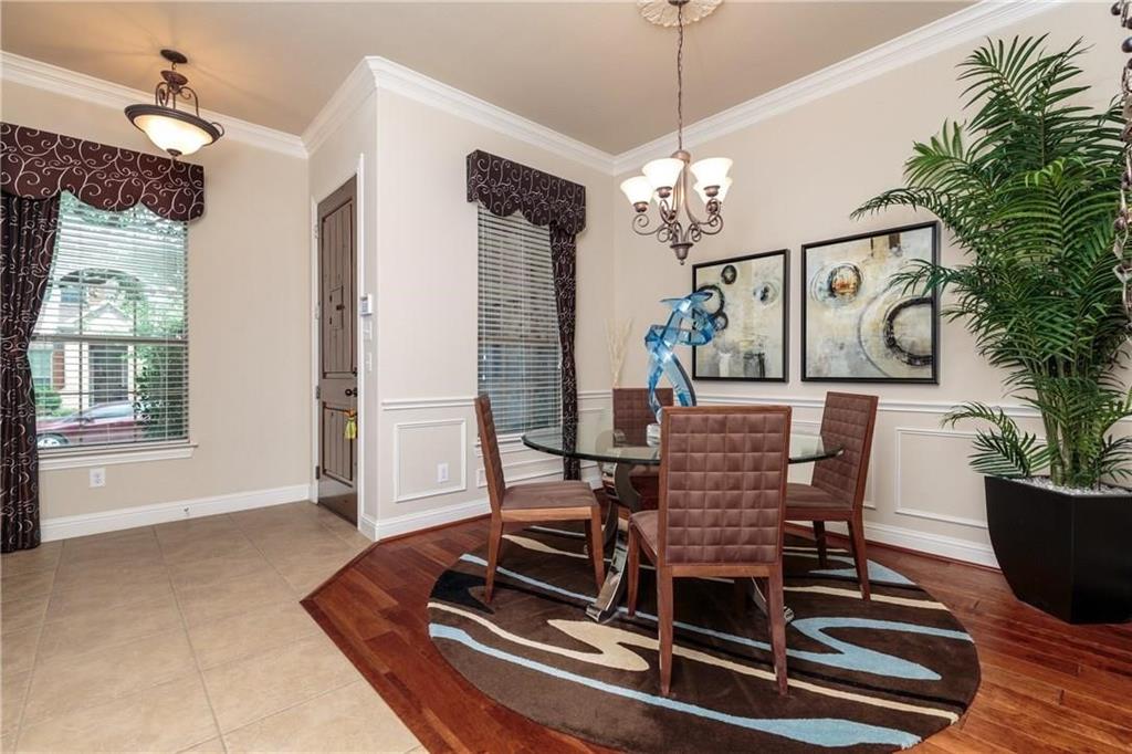 4673 Edith Street Plano, TX 75024 - Photo 10 of 35 a view of a dining room with furniture window and wooden floor