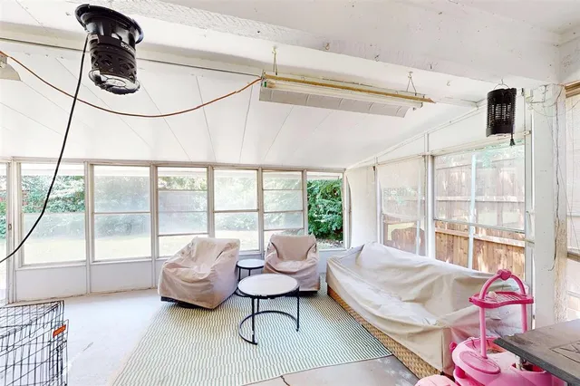 a view of a house with a yard and sitting area