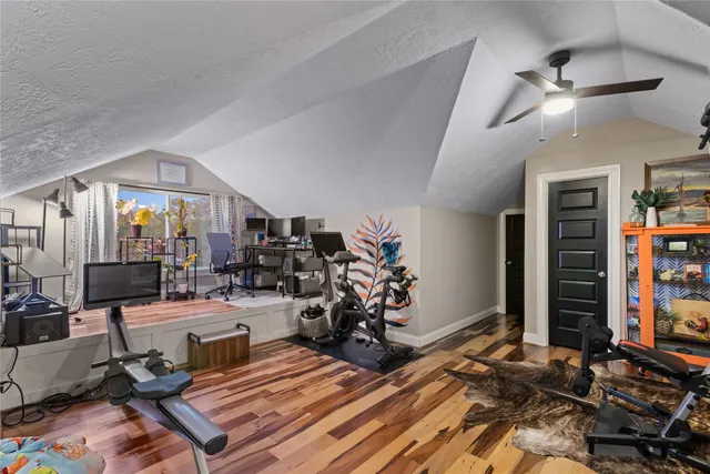 a room with lots of gym equipment