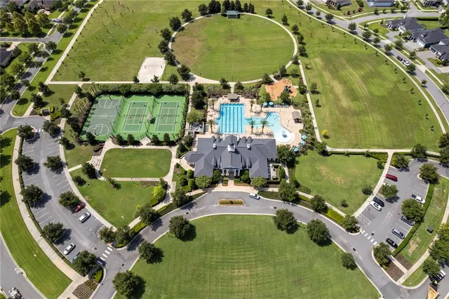an aerial view of a house with a swimming pool
