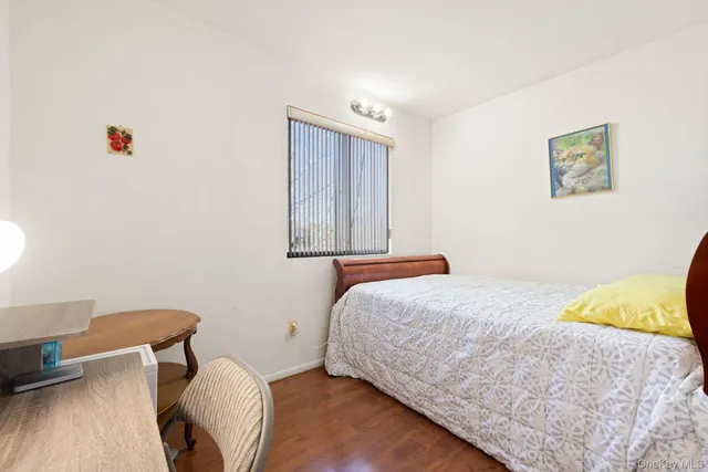 a bedroom with a bed and a cabinets
