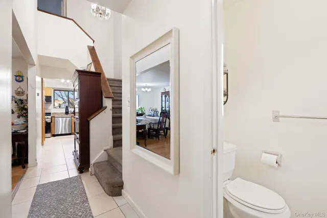 a bathroom with a glass door shower and a toilet