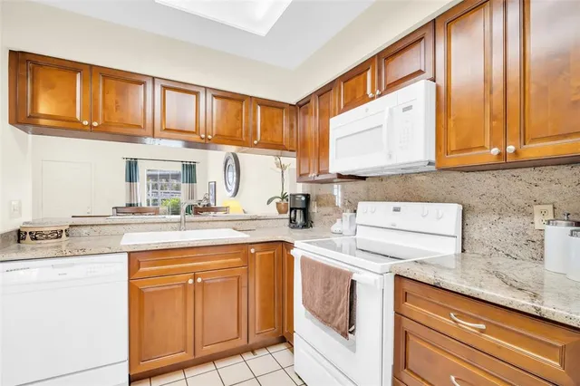 a kitchen with appliances cabinets and a sink