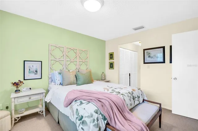 a bedroom with a bed and a table