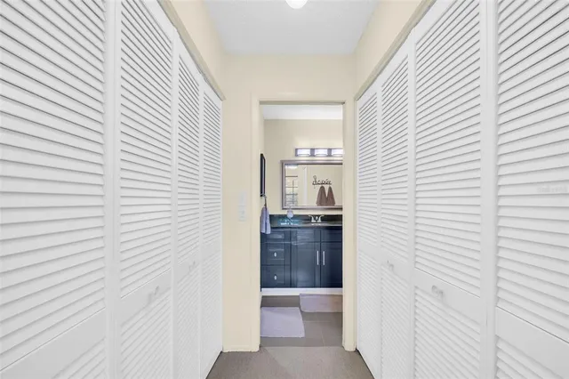 a view of a kitchen from a hallway