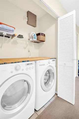a utility room with dryer and washer