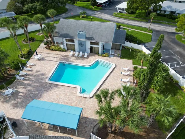 an aerial view of a house with garden space and street view