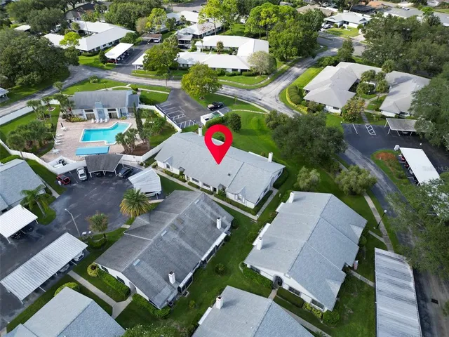 an aerial view of residential houses with outdoor space