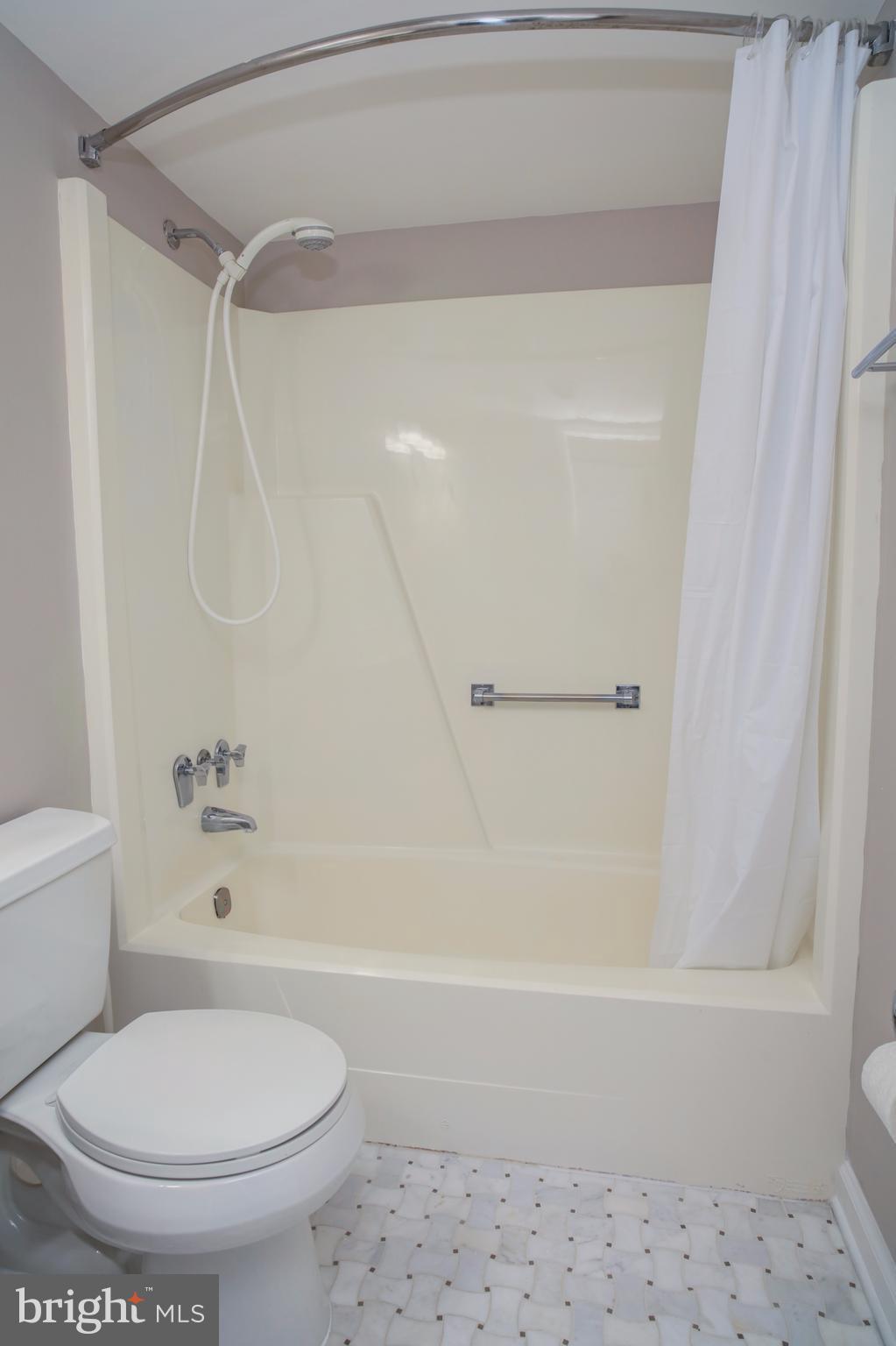 11616 Ivystone Court, Unit 301 Reston, VA 20191 - Photo 24 of 29 a bathroom with a toilet and a shower