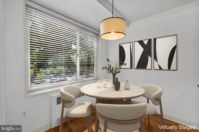 a dining room with furniture and window