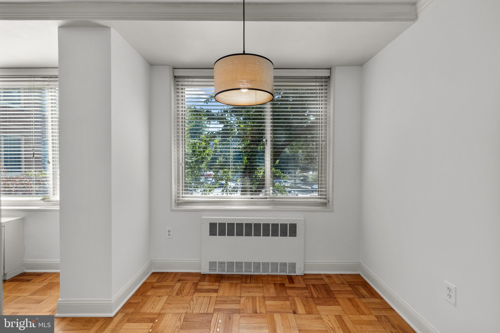 4000 Tunlaw Road Northwest, Unit 220 Washington, DC 20007 - Photo 15 of 33 a bathroom with a window and a shower