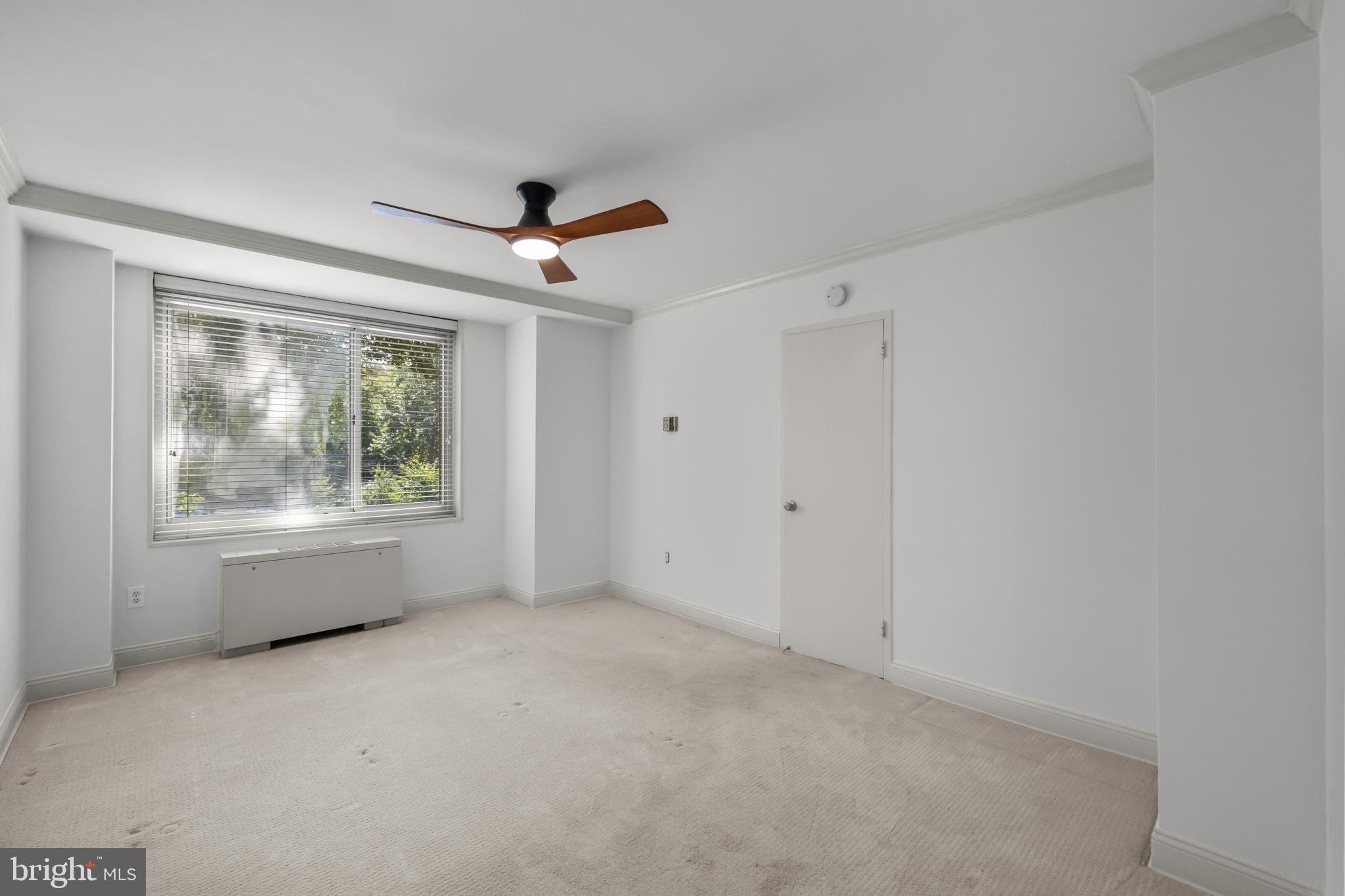 4000 Tunlaw Road Northwest, Unit 220 Washington, DC 20007 - Photo 20 of 33 a view of an empty room with a window