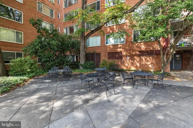 a backyard of a house with outdoor seating