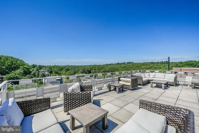 a terrace of a house with outdoor seating