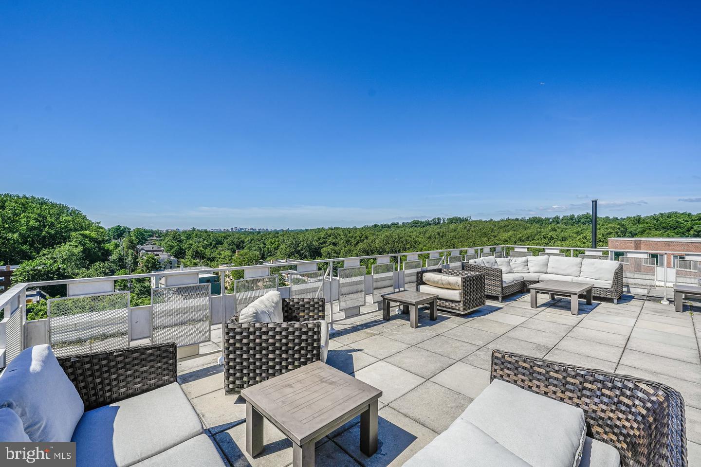 4000 Tunlaw Road Northwest, Unit 220 Washington, DC 20007 - Photo 30 of 33 a terrace of a house with outdoor seating