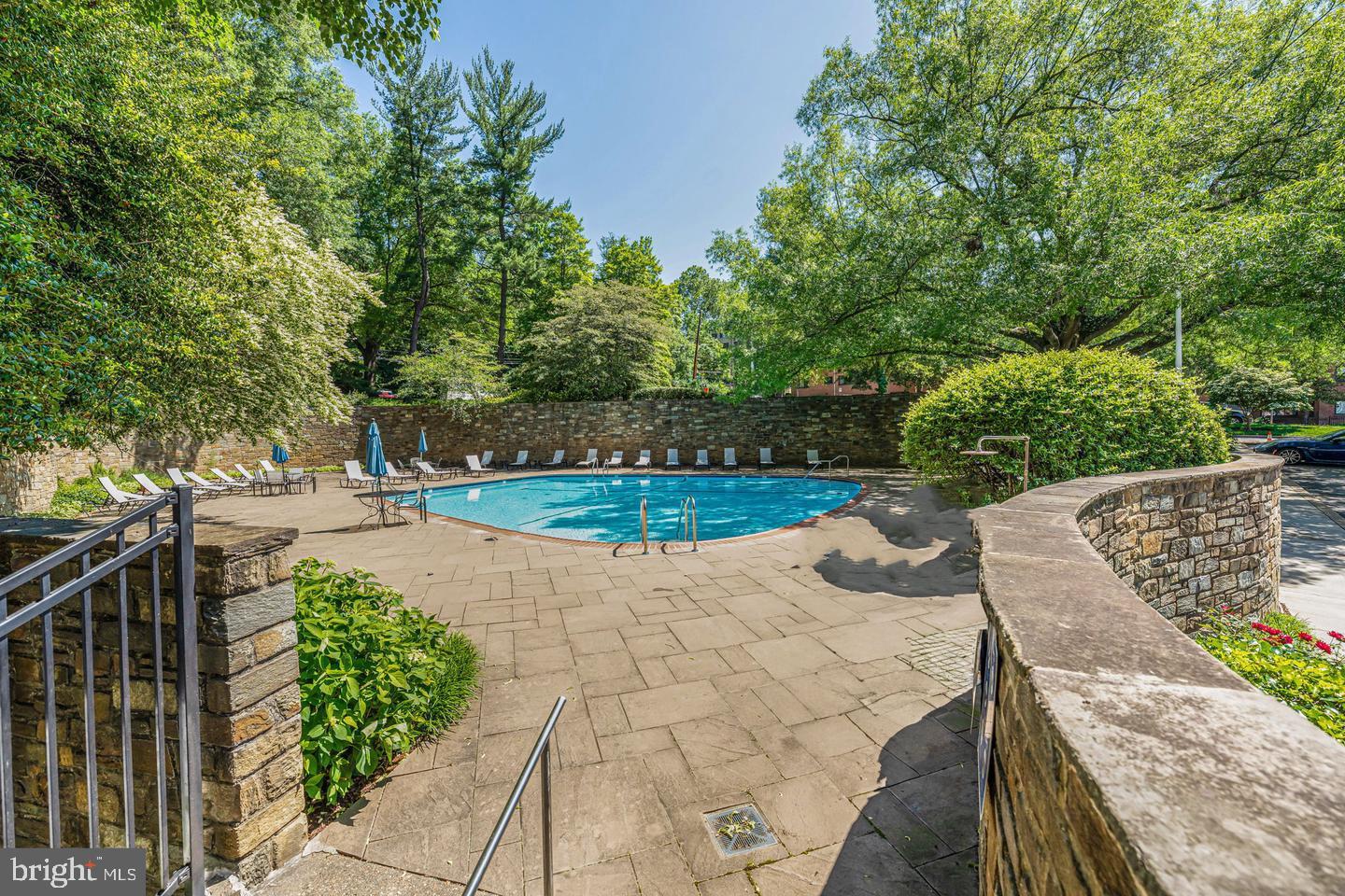 4000 Tunlaw Road Northwest, Unit 220 Washington, DC 20007 - Photo 4 of 33 a view of a terrace with a bench
