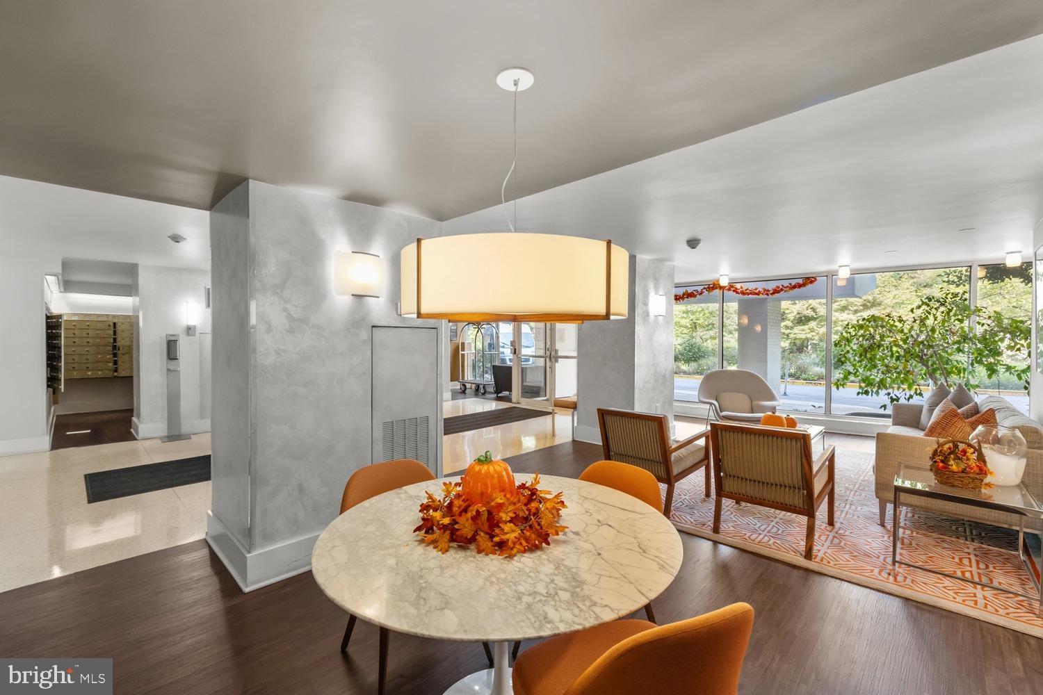 4000 Tunlaw Road Northwest, Unit 220 Washington, DC 20007 - Photo 7 of 33 a view of a dining room with furniture and wooden floor