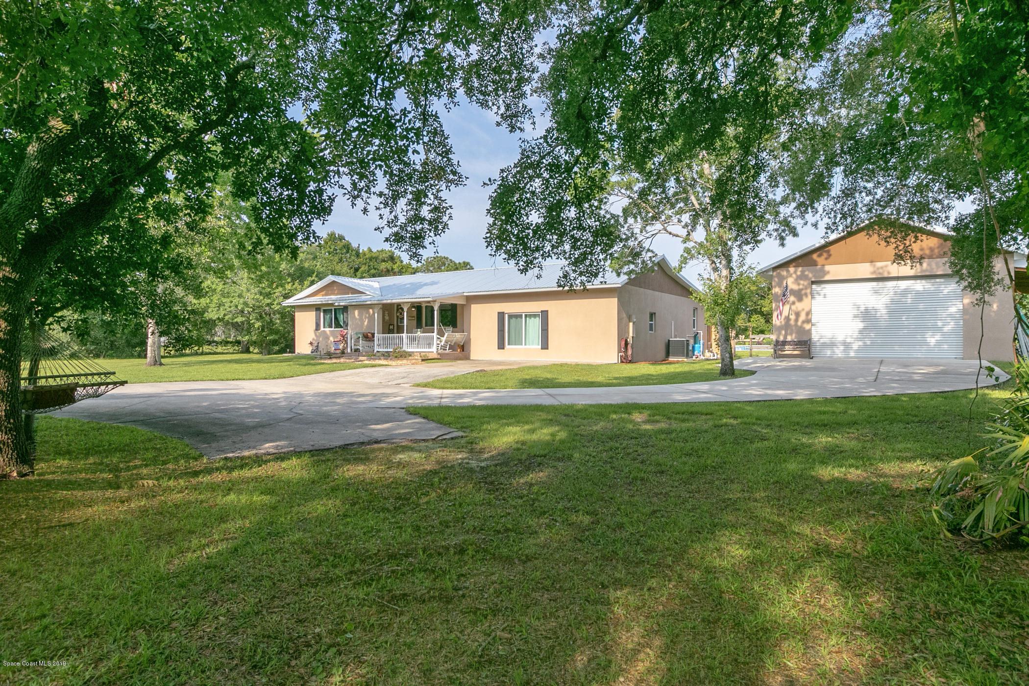 1760 Corey Road Malabar, FL 32950 - Photo 2 of 39 a house view with a garden space
