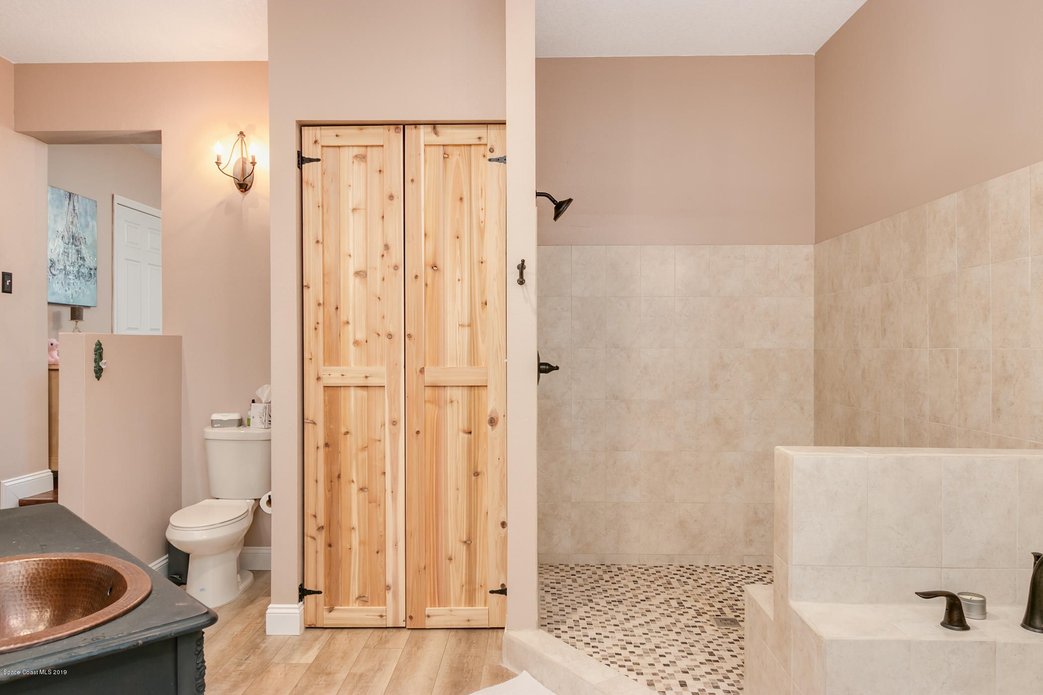 1760 Corey Road Malabar, FL 32950 - Photo 18 of 39 a bathroom with a shower and a toilet