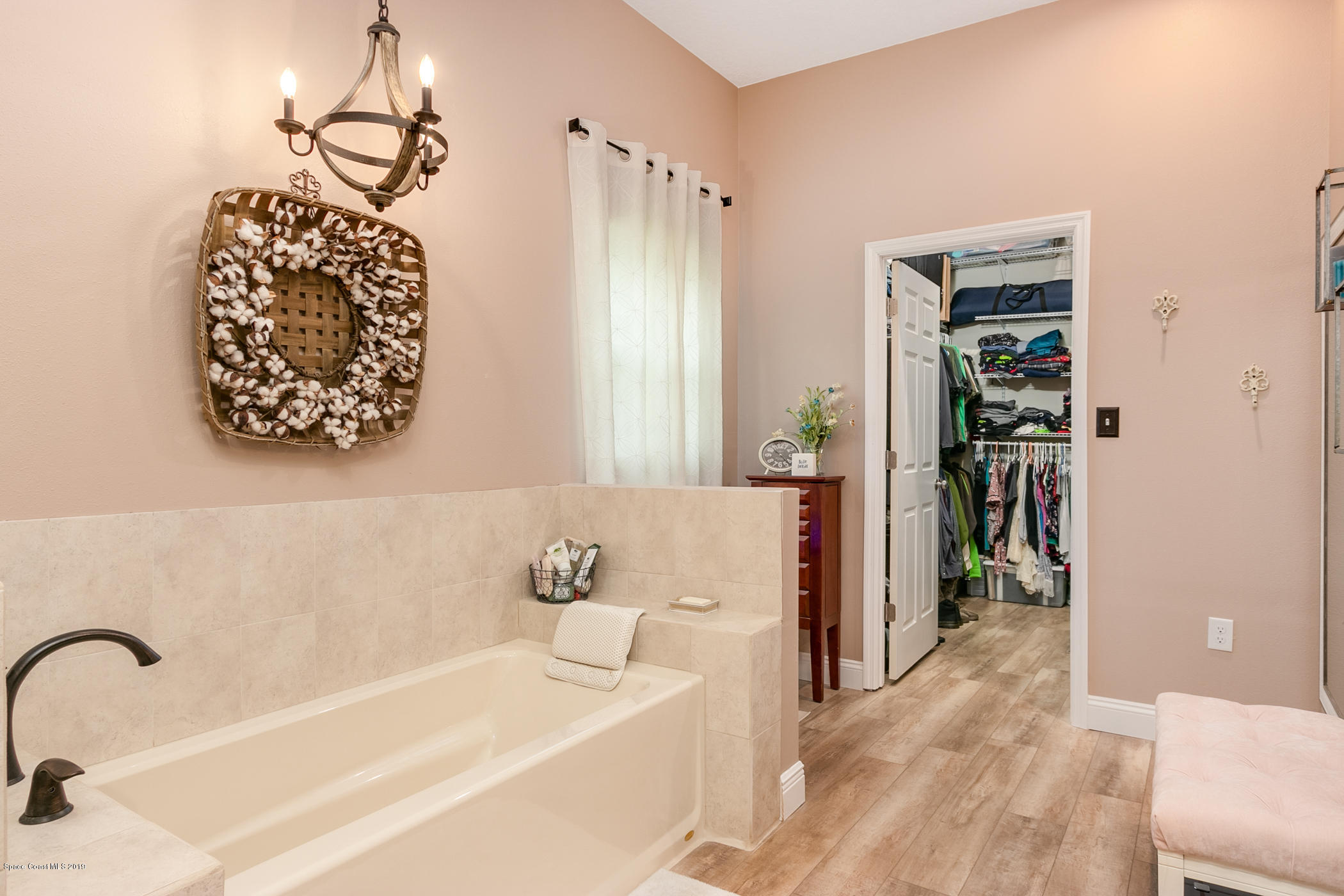 1760 Corey Road Malabar, FL 32950 - Photo 19 of 39 a bathroom with a bathtub and a shower