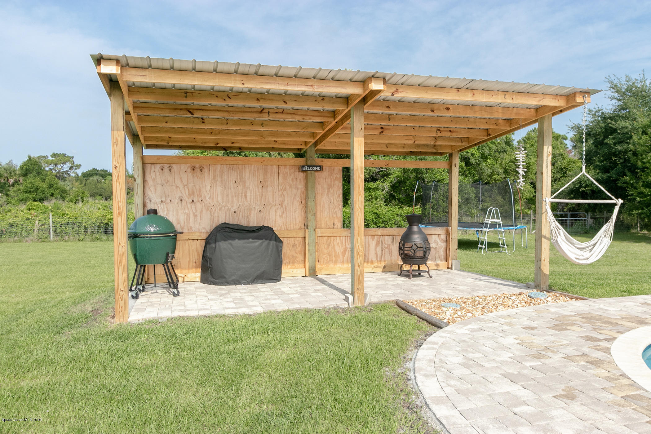 1760 Corey Road Malabar, FL 32950 - Photo 27 of 39 a view of a patio with a table and chairs