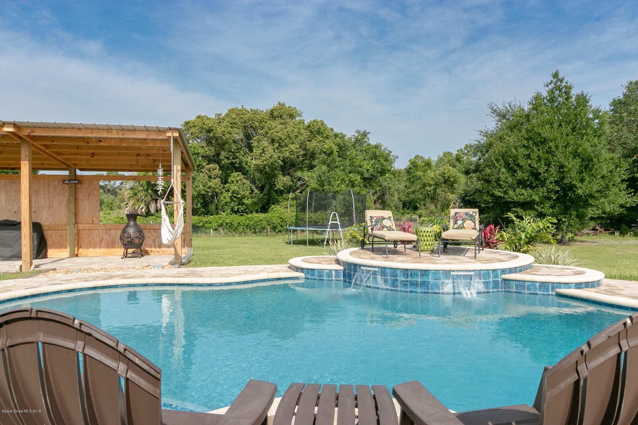 1760 Corey Road Malabar, FL 32950 - Photo 30 of 39 a view of a swimming pool with a patio