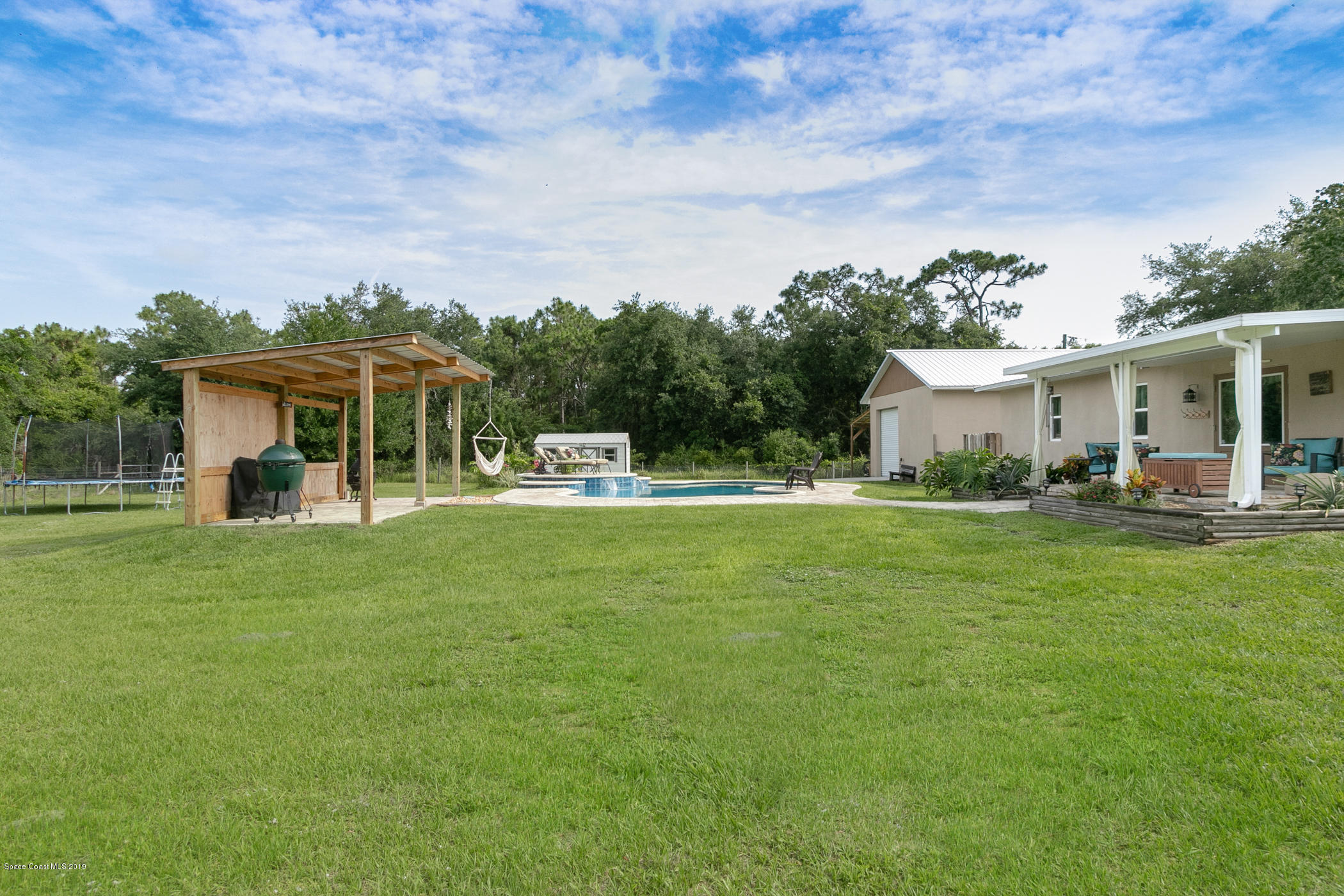 1760 Corey Road Malabar, FL 32950 - Photo 32 of 39 a front view of a house with garden
