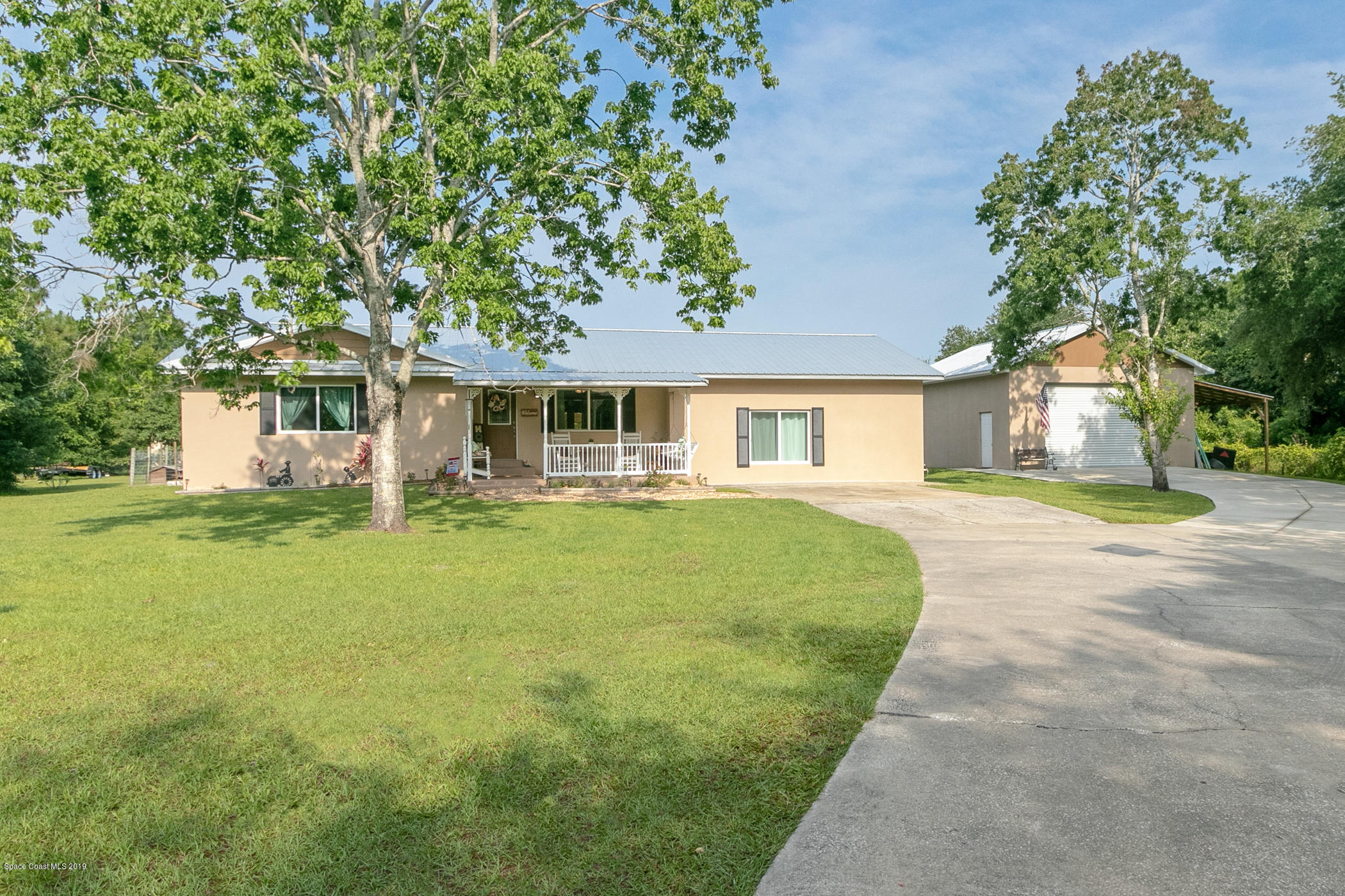 1760 Corey Road Malabar, FL 32950 - Photo 35 of 39 a front view of a house with a garden