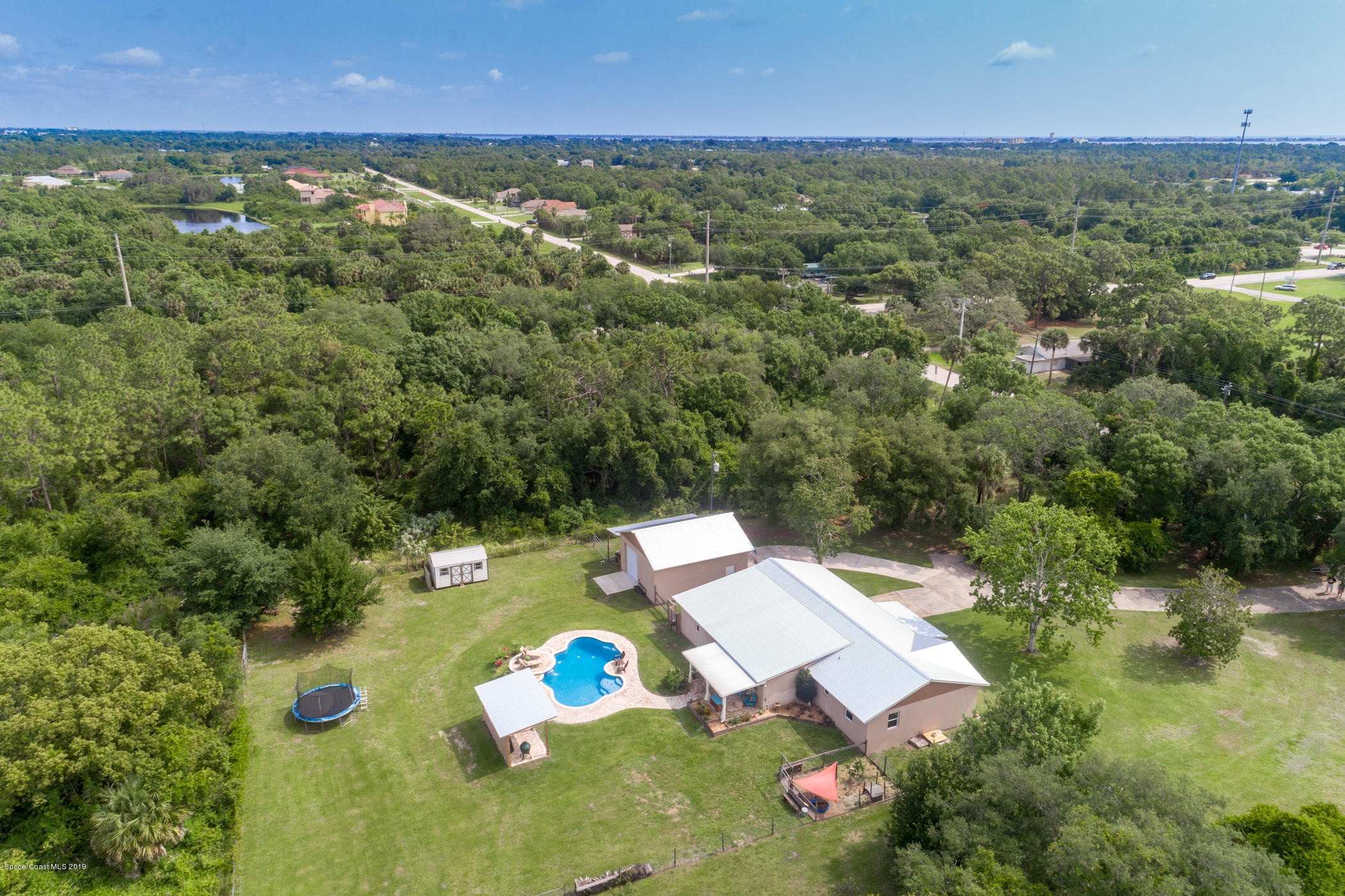 1760 Corey Road Malabar, FL 32950 - Photo 38 of 39 an aerial view of house with yard swimming pool and outdoor seating