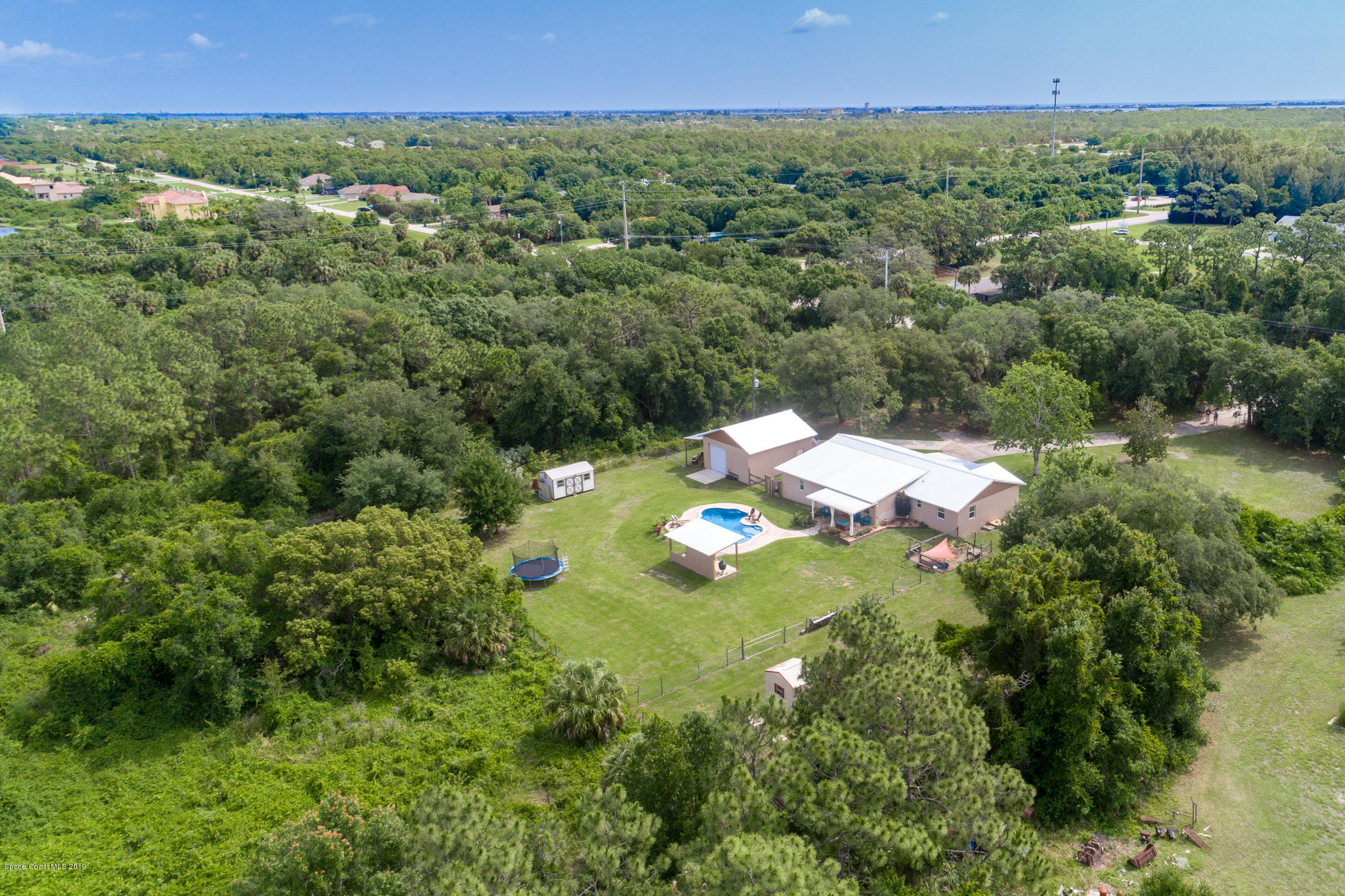 1760 Corey Road Malabar, FL 32950 - Photo 39 of 39 an aerial view of a house with a yard