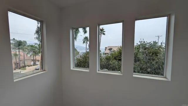 a view of a room that has a window in it