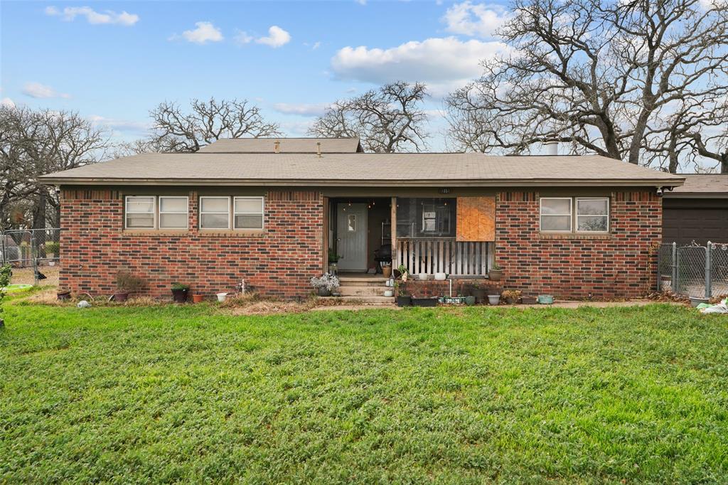 1051 Lynch Bend Road Springtown, TX 76082 - Photo 30 of 39 a view of a house with a backyard