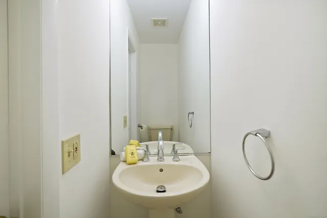 a bathroom with a sink and mirror