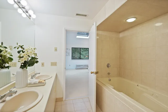 a bath room with a sink toilet and shower