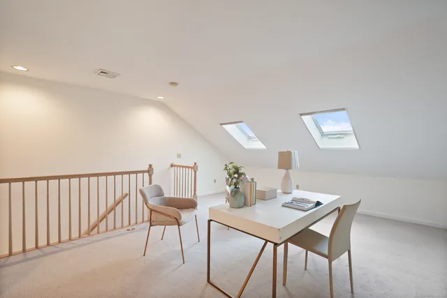 a workspace with furniture and window