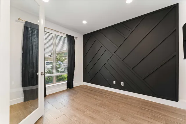 a bed room with a bed and a mirror