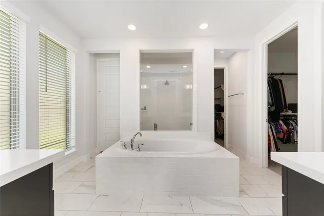 a white toilet sitting next to a bathroom sink