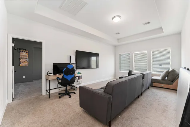 a view of an empty room with a fireplace