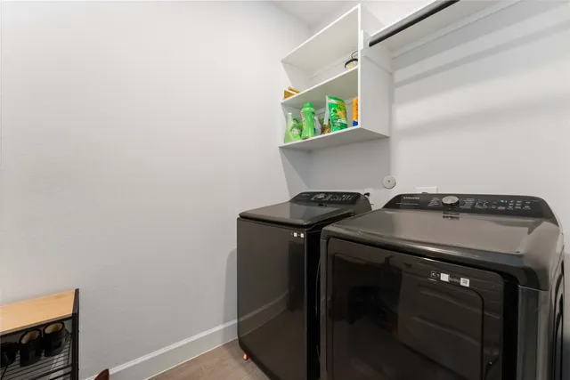 a view of a house with backyard and porch