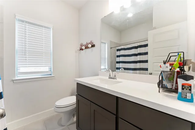 an aerial view of residential houses with outdoor space and swimming pool